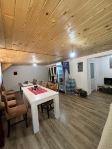 a living room with a white table and chairs at Hostel Sherifaj in Valbonë +19 photos