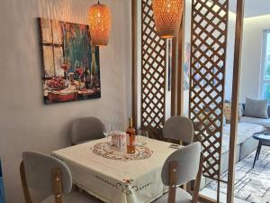 a dining room with a table with a cake on it at 60 seconds walk to the Beach in Golem