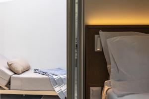 a room with a bed and a pillow on it at Bliss House in Rethymno