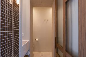 a bathroom with a sink and a toilet in a room at Bliss House in Rethymno