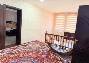 a bedroom with a bed and a window and a mirror at Marshall in Termiz