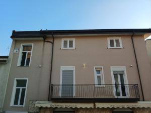 a large building with a balcony on the side at Victoria Home in Eboli