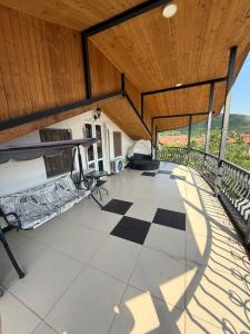 a large room with a balcony with bunk beds at Home in Mtskheta in Mtskheta