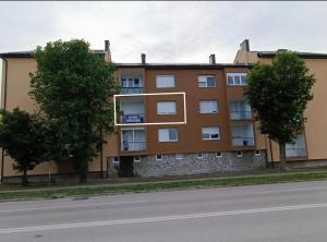 an apartment building on the side of a street at Apartman Škribulja in Županja