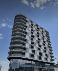 a tall building with a lot of windows at Dana Residence in Floreşti