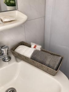a bathroom sink with a tray on top of it at Panagiotis Rooms in Naousa +29 photos