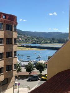 a view of a harbor with boats in the water at A Casa do Miradoiro in Puentedeume