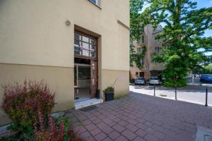 a building with a door on the side of it at S-HE Space - Budget Micro Rooms Kraków in Krakow
