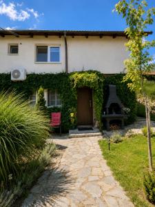 a house with a door and a patio at Romantic Mirka Apartment in Sremski Karlovci in Sremski Karlovci