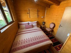 a bedroom with a bed in a wooden room at Azure Pool Residence in Sarajevo +30 photos