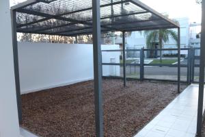 a view of a building with a metal roof at MRU Colón aparts in Colón