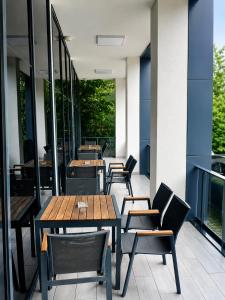 a row of tables and chairs on a patio at Yeşilyurt Park Otel in Çorlu