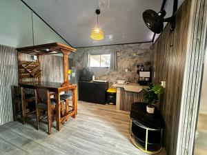 a kitchen and dining room with a table and chairs at Caribbean View House in Tortuguero +146 photos