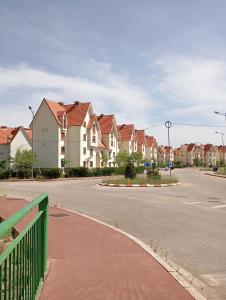 a row of houses on a street next to a road at Asrati in Ifrane