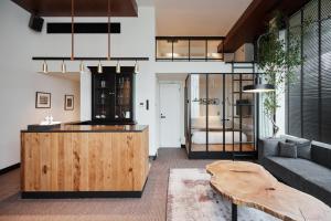 a living room with a table and a couch at TRUNK(HOTEL)CAT STREET in Tokyo