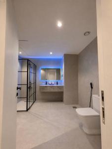 a bathroom with a toilet and a sink at برج داماك الكورنيش - Damac Al-Corniche Tower in Jeddah +78 photos