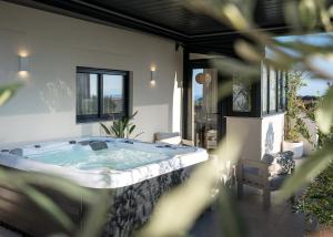 a jacuzzi tub on the patio of a house at Maslina Residence - Hvar in Hvar