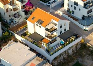 an overhead view of a house with an orange roof at Maslina Residence - Hvar in Hvar