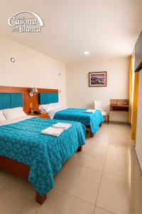 a hotel room with two beds and a bathroom at Casona Blanca in Arequipa +85 photos