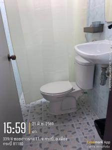 a bathroom with a toilet and a sink at Ao Nang Room And Bike 10 in Ao Nang  +5 photos