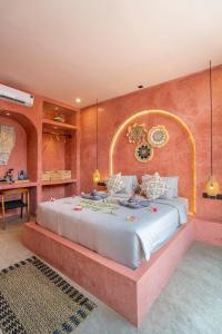 a bedroom with a large bed in a room at Villa Solea in Gili Trawangan