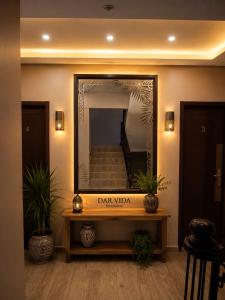 a large mirror in aoyer with a table and stairs at DAR-VIDA Guesthouse in Imsouane +33 photos