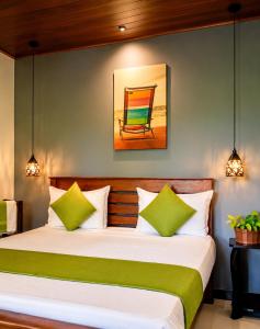 a bedroom with a bed and a chair at Thisara Guest House in Polonnaruwa