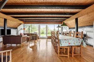 a kitchen and dining room with a table and chairs at FY196-Brenderup-Fyn-Bakkevej-15 in Vedelshave