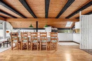 a kitchen and dining room with a table and chairs at FY196-Brenderup-Fyn-Bakkevej-15 in Vedelshave +16 photos