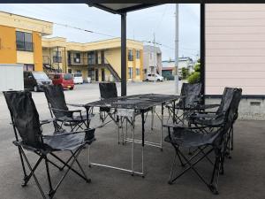 a table and chairs sitting in front of a building at Hoshiyado Nagayama in Asahikawa +86 photos