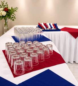 a table with many wine glasses on top of it at Shirley Retreat in Kingston