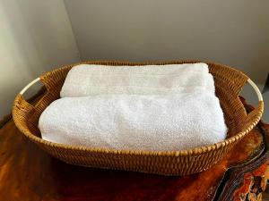 a basket filled with white towels on a table at La casita in Foz do Iguaçu +46 photos