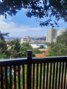a view of the city from a balcony at Loft vista a la bahía in Valparaíso