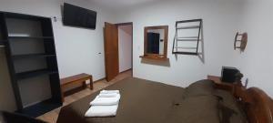 a room with a table and a television in a room at Complejo Cerro Morado in Villa Unión