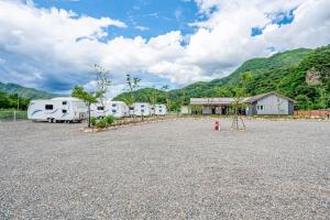 a group of rvs parked in a parking lot at Gapyeong JY Camping Caravan in Gapyeong