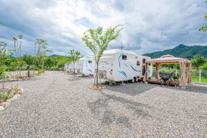 a row of rvs parked in a parking lot at Gapyeong JY Camping Caravan in Gapyeong