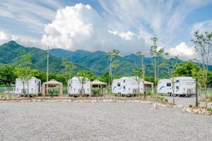 a group of rvs parked in a parking lot at Gapyeong JY Camping Caravan in Gapyeong +16 photos