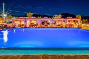a swimming pool at night with a restaurant at Pocheon Choice Camp Caravan in Pocheon +20 photos