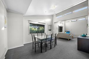 a dining room with a table and chairs at Sovereign Views Apartments in Ballarat