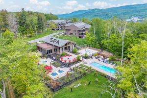 an aerial view of a house with a swimming pool at Tremblant Prestige - Verbier 4-202 in Mont-Tremblant