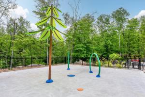 a playground with a bunch of play equipment at Tremblant Prestige - Verbier 4-102 in Mont-Tremblant