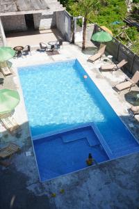 an overhead view of a large blue swimming pool at Guest House on Rustaveli 176 in Kobuleti