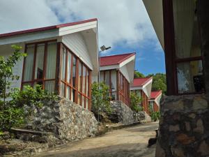 a row of houses with red roofs at Alicia Resort in Koh Rong Island
