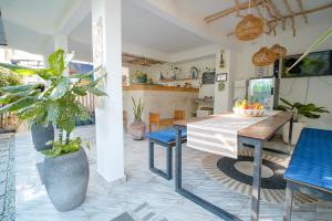a kitchen and dining room with a table and chairs at Drift Hideaway- Adult only in Kuta Lombok