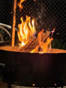 a grill with a lot of fire in it at Casa Azul Mountain Resort in Nathia Gali