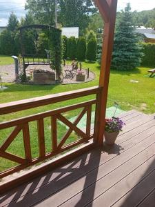 a wooden deck with a view of a park at Temeszówka domek do wynajęcia in Temeszów +31 photos
