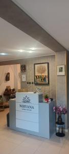 a counter in a room with flowers on it at Nirvana Guest House in Nesebar +96 photos