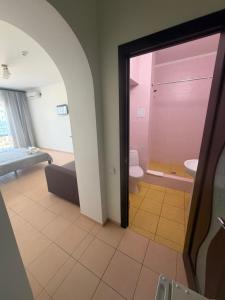 a room with a bathroom with a toilet and a sink at Hotel Olimp in Zatoka +82 photos