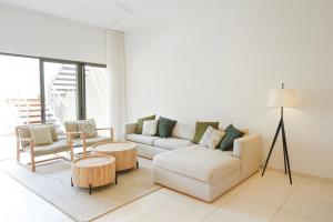 a living room with a couch and two chairs at Villa Eden - 2 bedrooms with Private Rooftop Terrace & Pool, Ki Residences, Pereybère - KSN Collection Privée in Grand-Baie