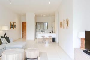 a living room with a couch and a table at Villa Eden - 2 bedrooms with Private Rooftop Terrace & Pool, Ki Residences, Pereybère - KSN Collection Privée in Grand-Baie +38 photos